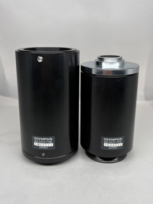Olympus BX-DUV-TV5 / BX -DUV-TVB Microscope C-mount Camera Adapter displayed side by side in good optical condition.