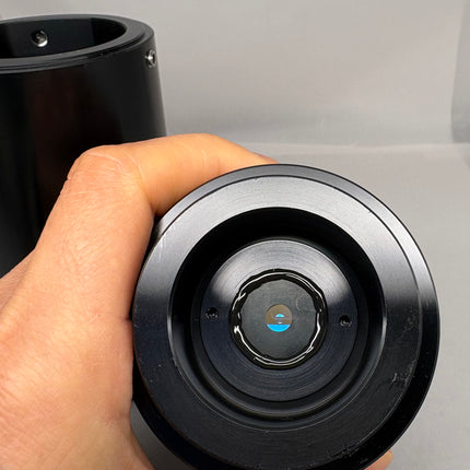Close-up of Olympus BX-DUV-TV5 / BX -DUV-TVB Microscope C-mount Camera Adapter held in hand.