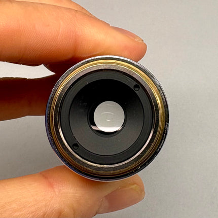 Nikon LU Plan ELWD 20x0.40 ∞/0 EPI WD 13 M25 Microscope Objective lens held in hand, showcasing its design and optical elements.