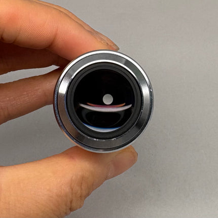 Nikon L Plan SLWD 50x0.45 ∞/0 EPI WD17 M25 thread Objective viewed from the front with a hand holding it.