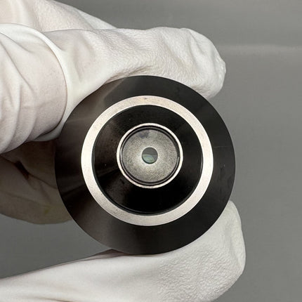 Olympus UMPlanFl 40x0.75 ∞/0 Microscope Objective lens held in a gloved hand.