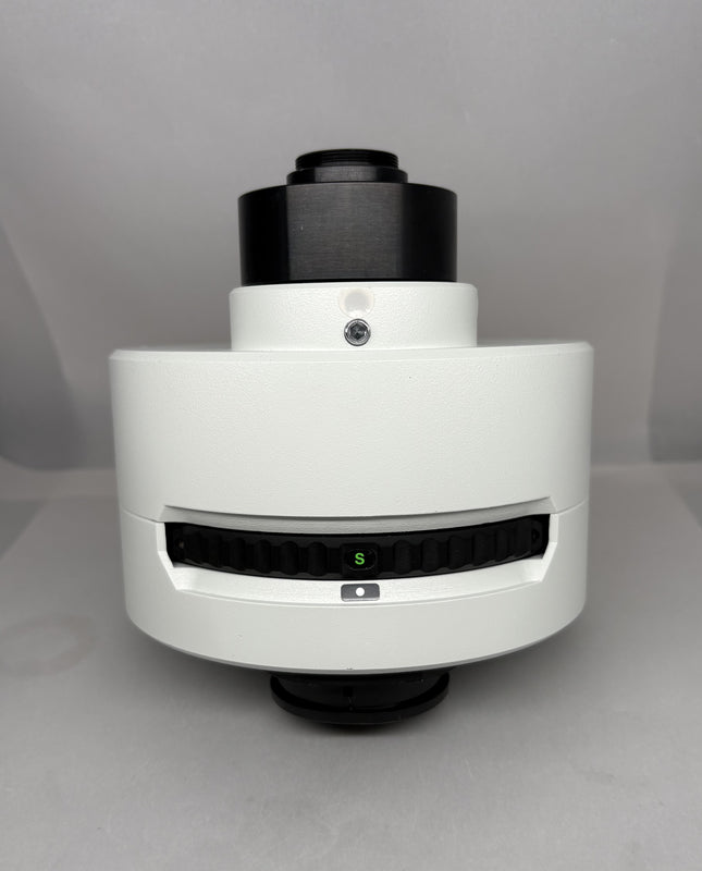 Olympus U-TVCAC C-mount video magnification change unit (IR-compliant) front view, showing turret and focus elements.