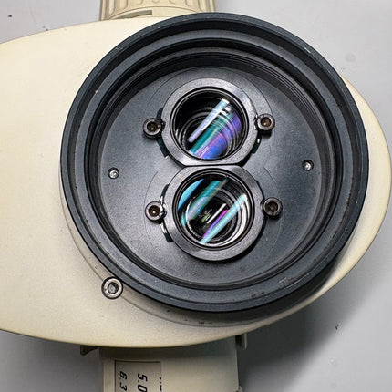 Close-up view of Leica MZ12.5 Stereo Microscope Zoom body 10446370 dual lens system with optical components.
