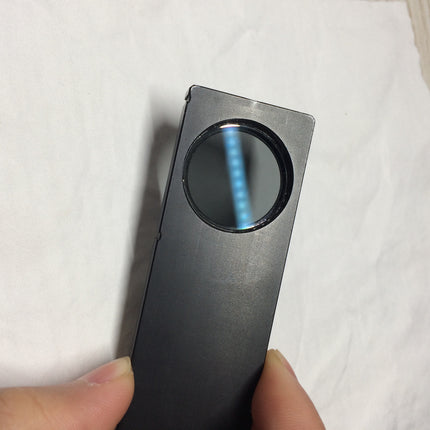 Olympus Microscope Analyzer Slider U-AN held in hand to showcase optical features