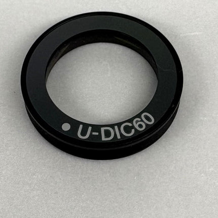 Olympus Microscope U-DIC60 DIC Nomarski Prism , showing U-DIC60 model name detail on the optical component.