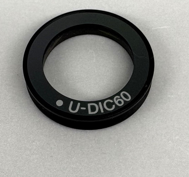 Olympus Microscope U-DIC60 DIC Nomarski Prism , showing U-DIC60 model name detail on the optical component.