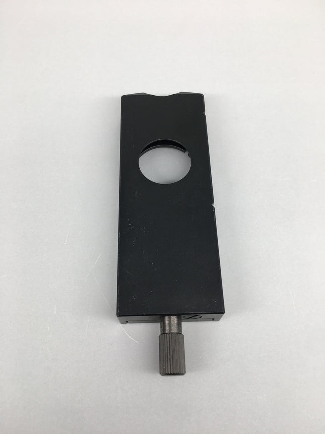 Olympus Microscope U-DICT Transmitted DIC Nomarski Prism Slider shown from top view with a circular opening.