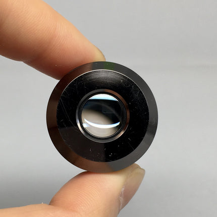 Olympus Objective LMPlan 5X0.10 IR ∞/0 RMS Thread held in hand, showcasing the optical surface.