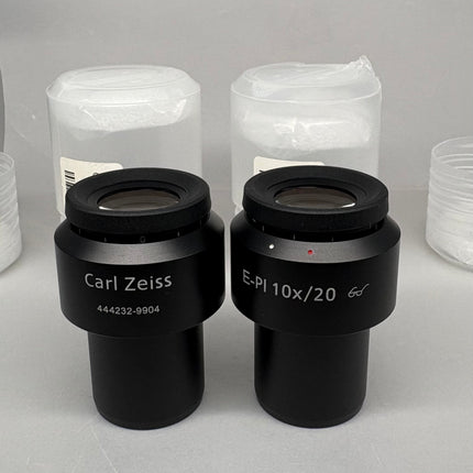 Pair Of Zeiss Microscope Eyepieces E-PI 10x/20 444232-9904-000 displayed with protective covers.