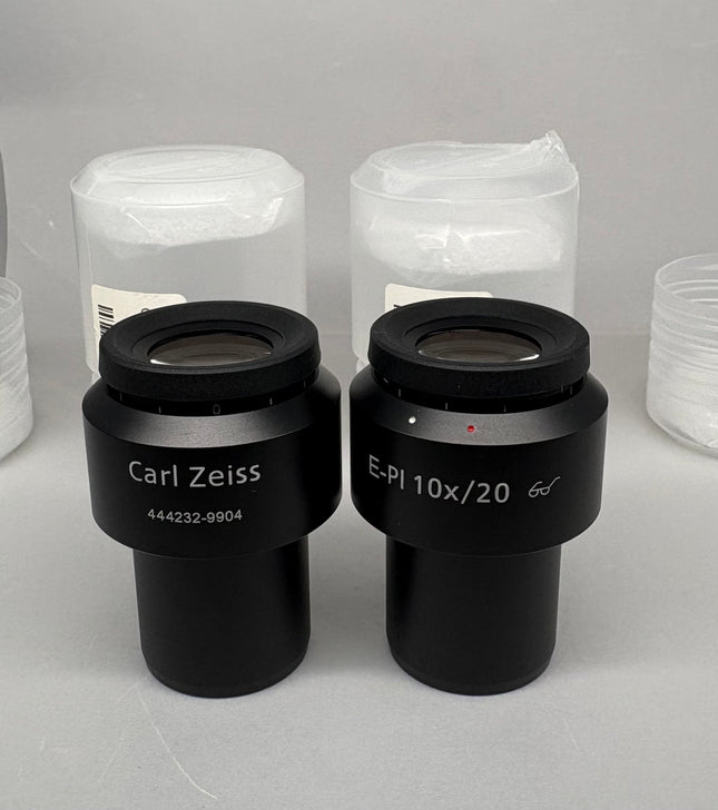 Pair Of Zeiss Microscope Eyepieces E-PI 10x/20 444232-9904-000 displayed with protective covers.