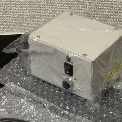 Narishige MM-80 Motorized 3-Axis Coarse/Fine Micromanipulator on bubble wrap with power supply.